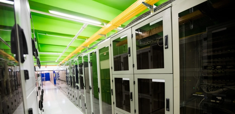 An image that show Hallway with a row of servers