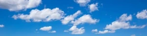 a cloud in a blue cloudy sky