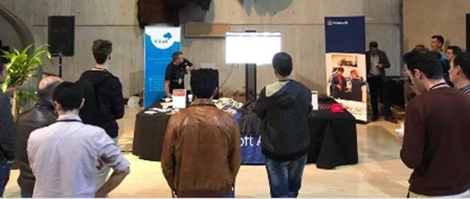 a group of people standing in a room at container camp sydney