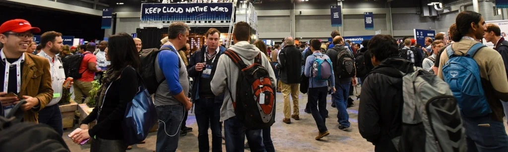 a group of people standing in front of a crowd