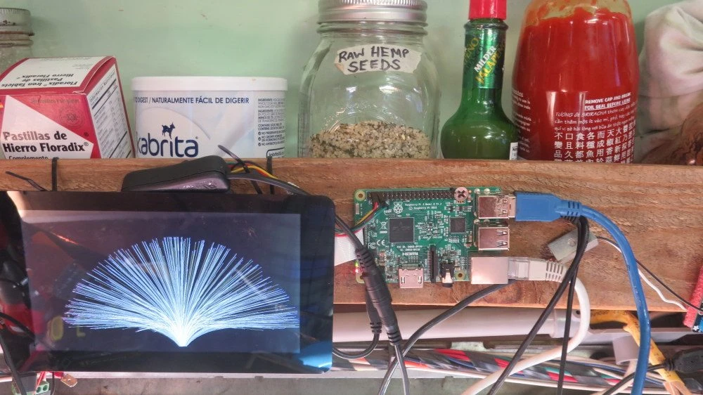 An image of a tablet propped up against a work station.