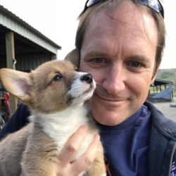 a man and a dog posing for the camera