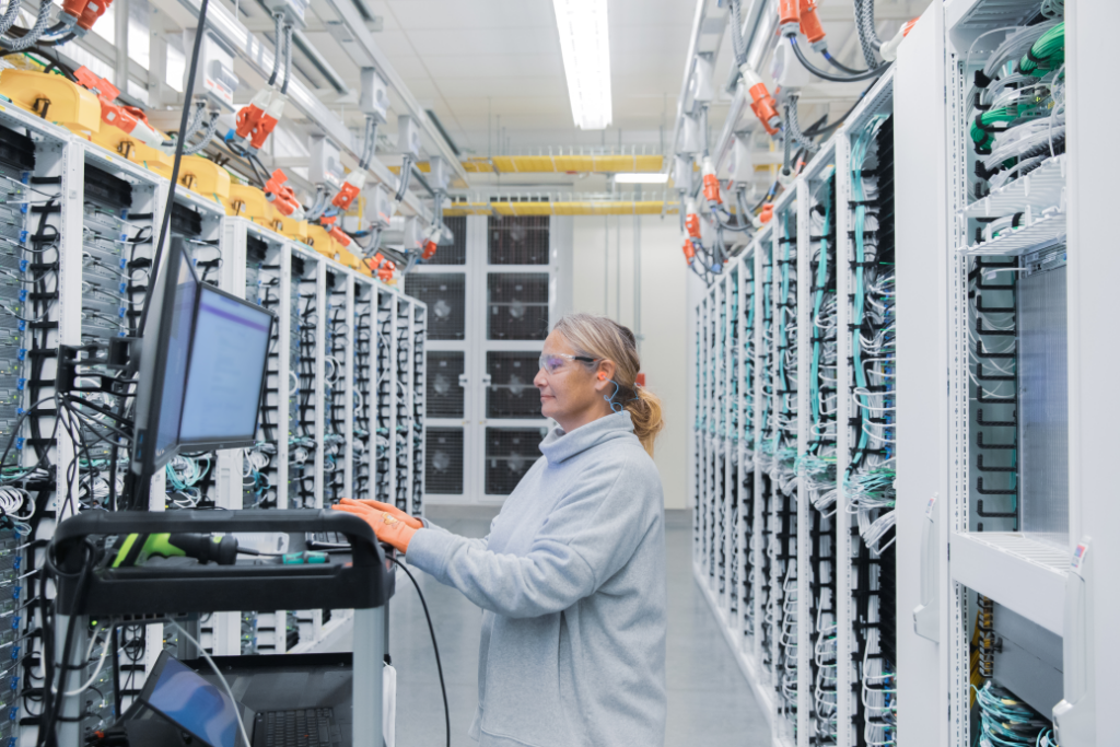 a person standing in front of a computer