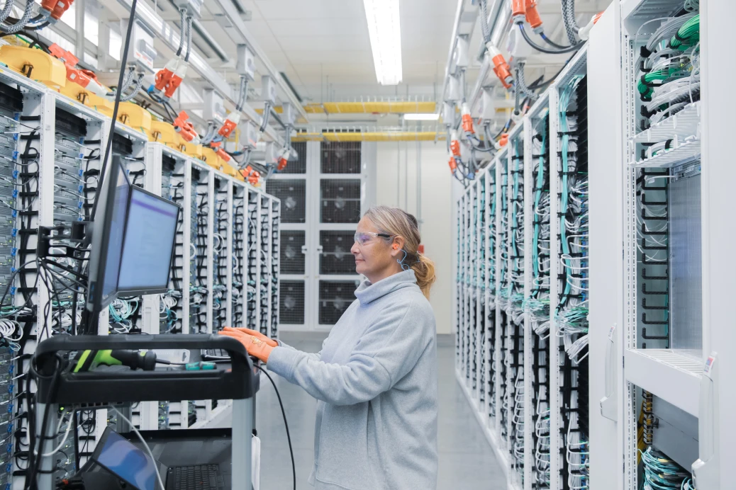 a person standing in front of a computer