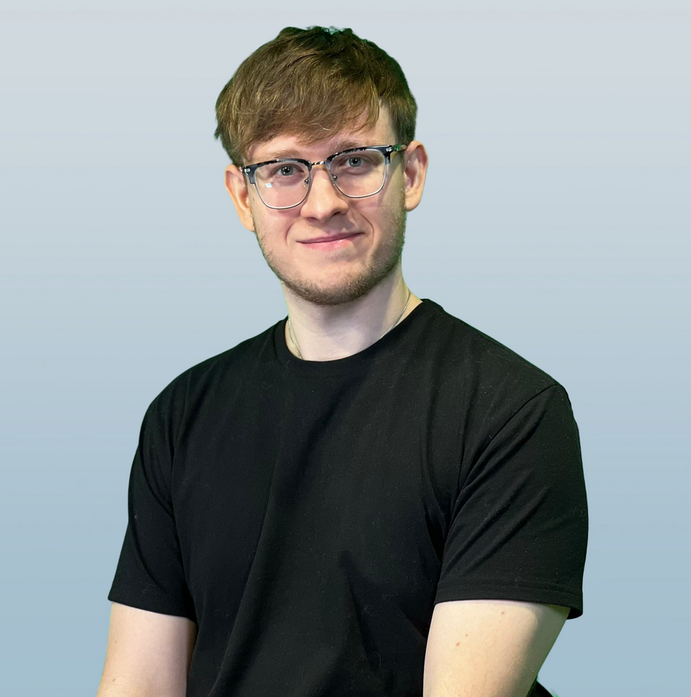 A man wearing glasses and a black shirt