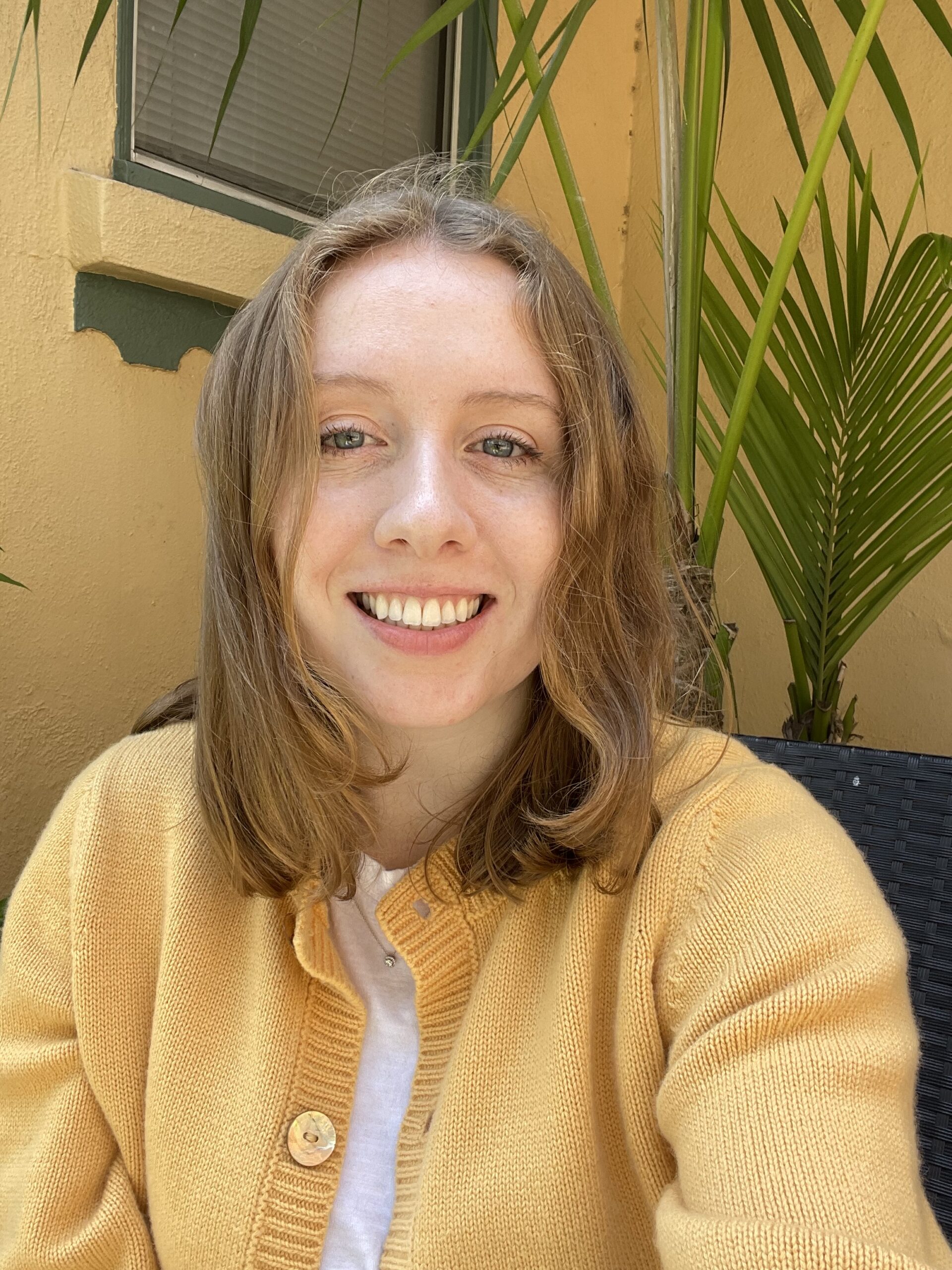 Person wearing a yellow sweater.
