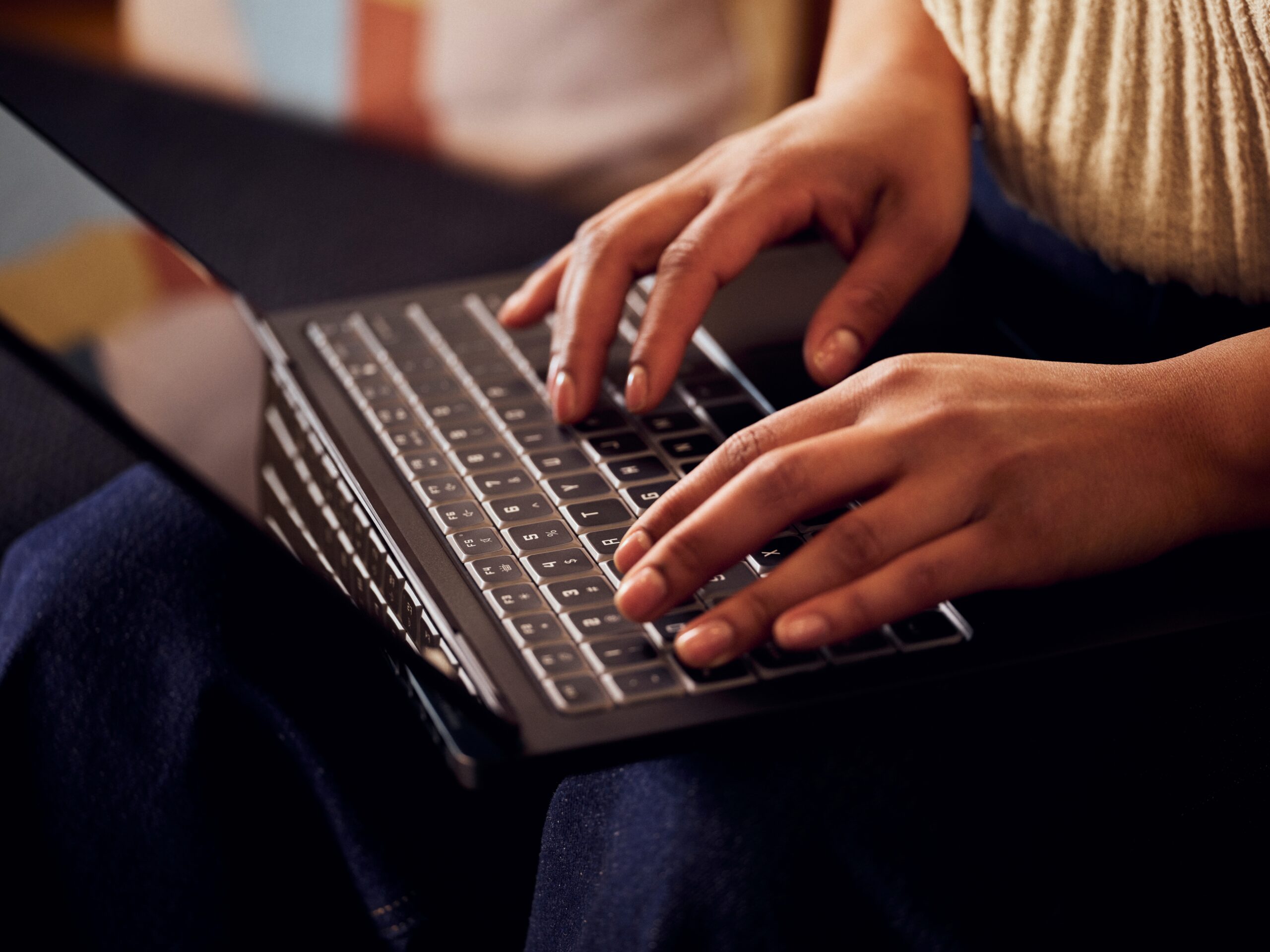 Close up of female developer hands typing on a laptop keyboard